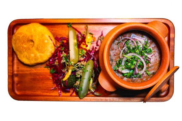 bean stew with pickled vegetables and corn bread