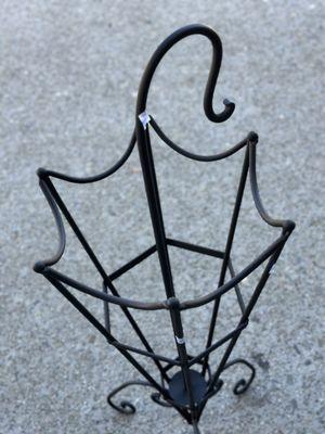 Cute iron umbrella stand for $12.