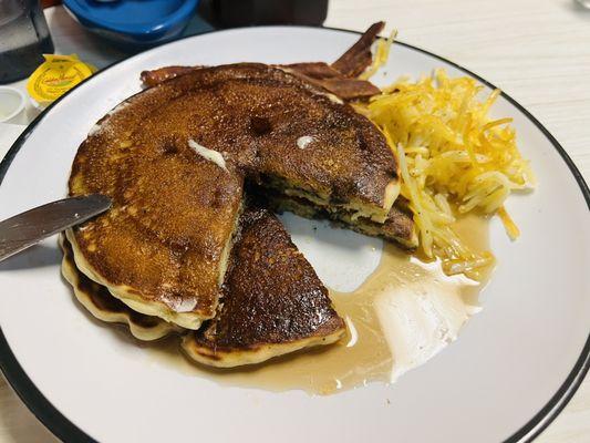 Blueberry small stack with hash browns and crispy bacon.