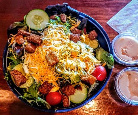 Large Garden Salad - spring mix with tomatoes, cucumbers, red onions, cheddar cheese, jack cheese, croutons and eggs, 1000 Island dressing