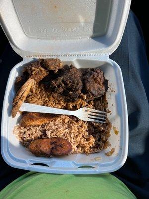 Stew chicken, rice and beans with fried plantain.