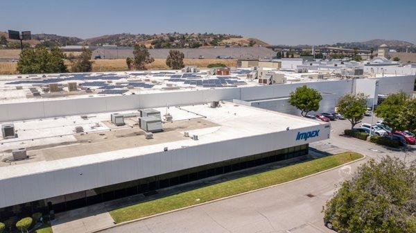 Commercial solar installation at the Impex Fitness Equipment building in Pomona. Includes 1,000 SolarMax SMX 265 solar panels for 265 kW