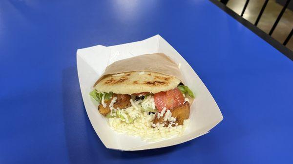 Vegetarian arepa with Mano cheese lettuce, tomato, beans