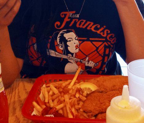 Fried chicken, fish, and fries combo.