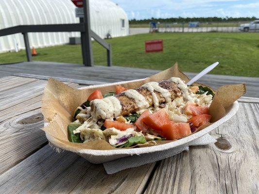 Salad with grilled mahi and slaw.