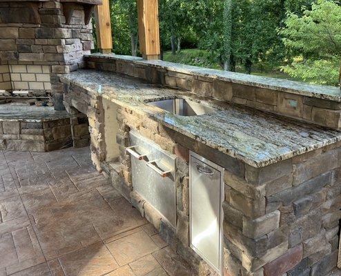 Granite countertop installed in this beautiful outside kitchen