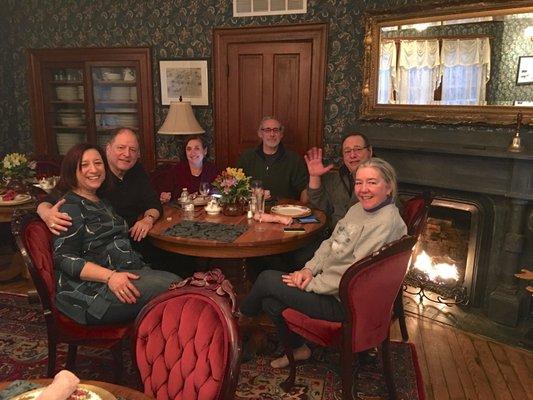 Guests enjoy laughter and conversation in the dining room.