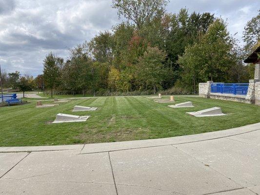 This area in the front of the park was once just a gravel circle. Now it has grass along with games to play.