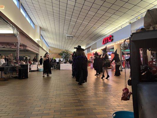 Dancing witches behind a creepy car