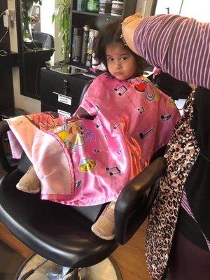 Adorable infant getting her ends cut