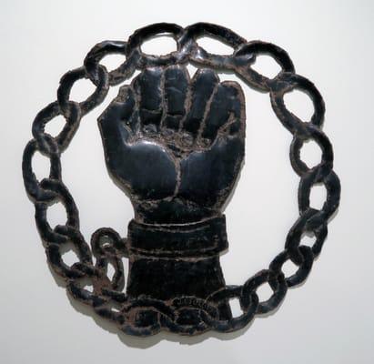 Justine Georges; unknown (Fist); 1969; metal cut from oil drum