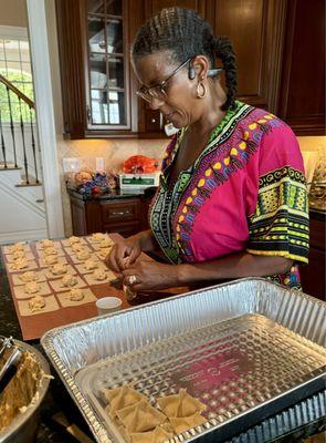 Angela making crab and crawfish ragoon from scratch.