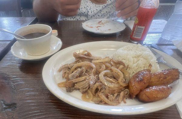 Roasted pork with rice, beans and plantain