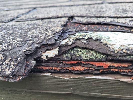 Layer after layer of shingles on roof.