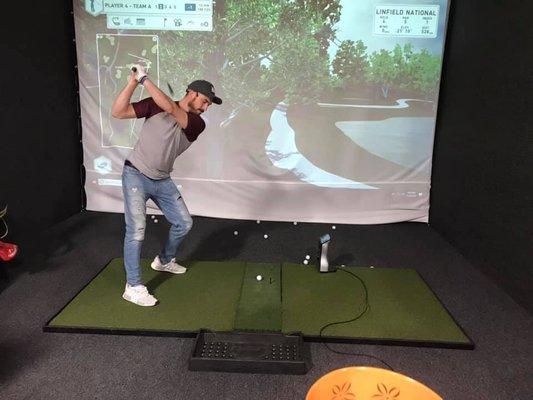 Indoor golf simulator- great for a round of golf, practice, and fundraisers (indoor golf tournaments)