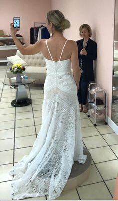 She added straps, a bustle, did a hem, and took in the sides.