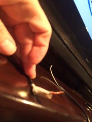 Bare wire behind TV with no connector labeled 'audio'.