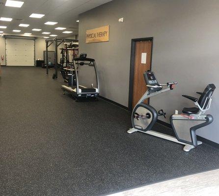 To the right of the front entrance and front desk, is the door to the Serene Strength Massage Room.