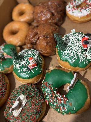 Holiday special donuts and apple donuts, classic glaze, vanilla sprinkle.