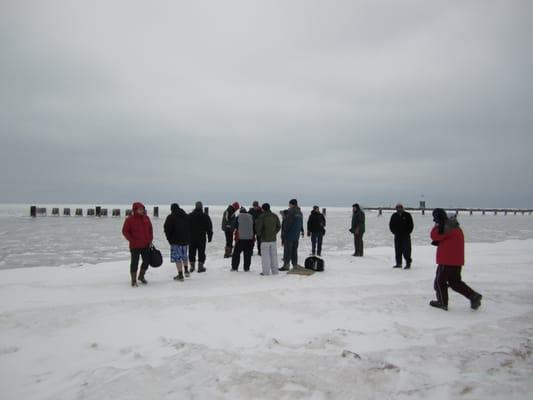 People looking at the ice and wondering how they would plunge into the lake this year.