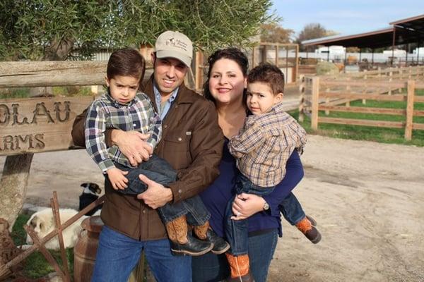 Walter and Elizabeth Nicoloau at their farm with their two sons (Stanislaus Magazine cover)