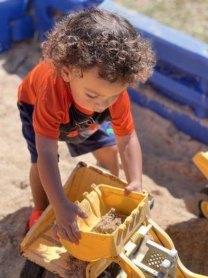 He loved that they had a sand area with big construction trucks