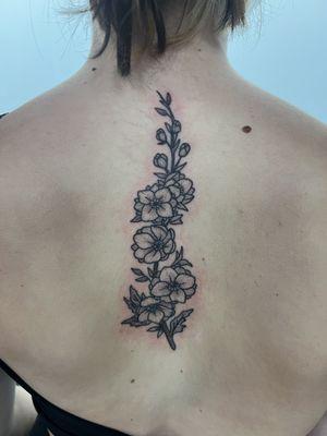 Floral spine tattoo