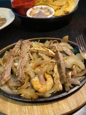 One of my favs.  Grilled chicken, steak, shrimp onions green pepper. Texas Fajita w/ soft or hard tortillas on side. Served sizzling hot Yum