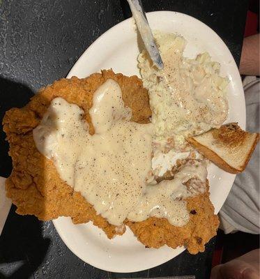 Chicken fried steak, mashed potatoes and gravy. These plates are huge and the food didn't fit on it. You won't go away hungry!!