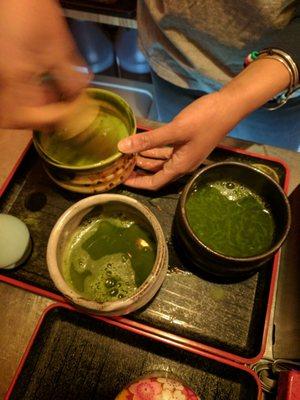 Whisking the matcha with water