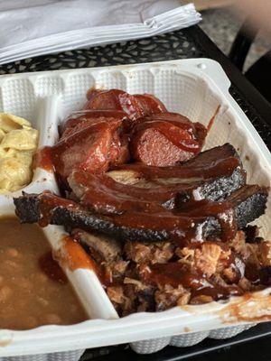 3 meat platter -  Smoked Pulled pork, Texas style brisket, and smoked sausage with classic baked beans and a pasta salad.