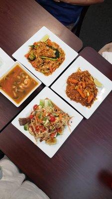 Tom yum soup, som-tam with fried fish, pad thai with seafood, and pad woon sen with moo-grob