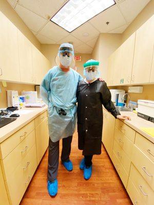 Drs. Weiss and Kleiner in all of their personal protective equipment to create a safe dental experience for patients coming into the office.