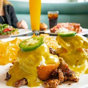 Border Benedict
 
 Poached eggs, seasoned carne asada, and sweet corn cakes topped with our homemade poblano sauce and fresh sliced jalapeño