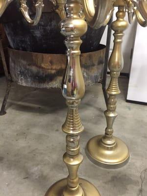 The candelabras where supposed to be gold. She spray painted them witch would of been fine if she would of actually tried!