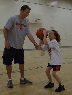 Explaining the BEEF shooting method to a camper.