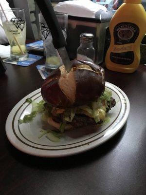 Cheeseburger with a  pretzel bun