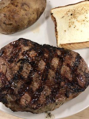 HUGE delicious ribeye (cooked to order), Texas toast, baked potato, and salad all for $17