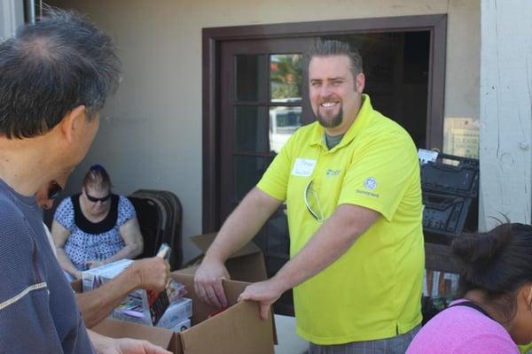 Co-Owner and Director of Installations Bryson Solomon donating his time and energy to a local food bank. And smiling every step of the way!