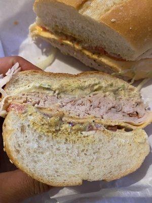 Turkey, american, provolone, lettuce, tomato, pickles, mayo, mustard, salt, pepper, oil, vinegar