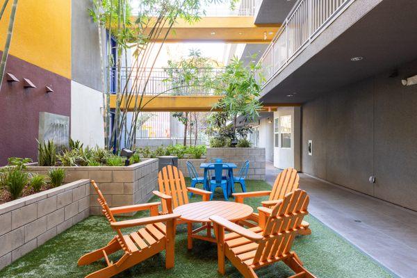 Shaded courtyard with patio lounge seating