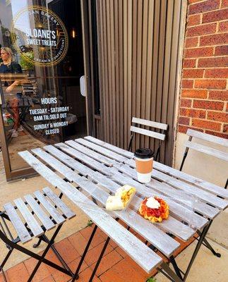 Several small tables out front at Sloane's.