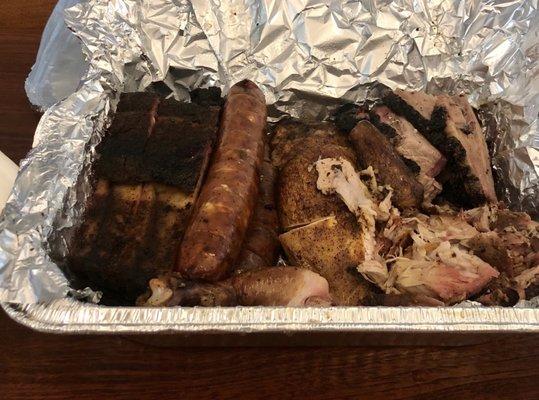 Picnic for four take out: ribs, sausage, chicken and pulled pork. Excellent!