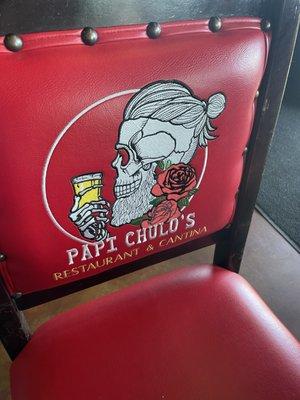 Papi Chulos logo on chair