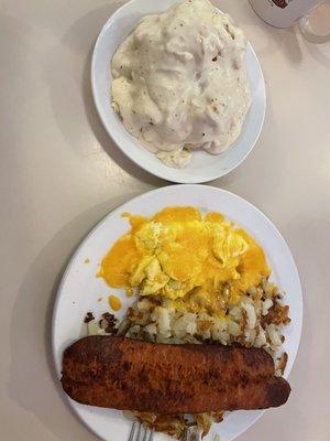 Two eggs, linguisa, hash browns, and biscuit/gravy.