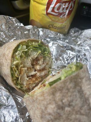 Chicken Caesar Wrap with crispy chicken in a wheat wrap. Lays on the side is a must!