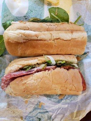 Footlong size bread cut unevenly to make two six inches. One sandwich is shorter than the other. Server didn't cut evenly.