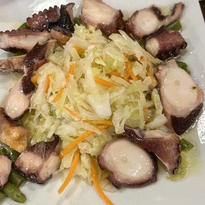 Cold octopus with mouthwatering cabbage salad.