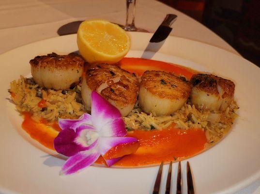 Scallops over rice pilaf