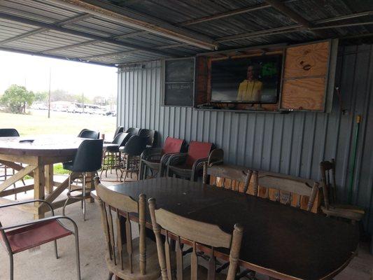 Outside seating with TV and music.